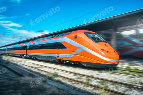 Preview: High-speed passenger train moving at railway station at sunset