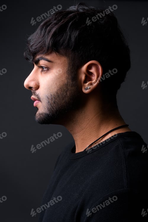 Preview: Young handsome Indian man against gray background