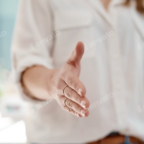 Hand Reaching Forward Offering Handshake Indoors