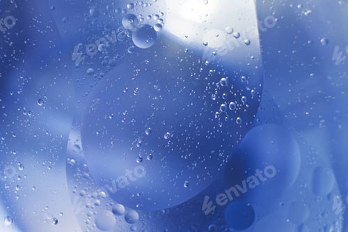 Preview: Oil bubbles close up. circles of water macro. abstract light blue background