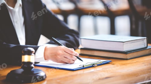 Preview: judge with hammer lawyer justice a businessman in a suit or a lawyer working on paperwork Legal conc