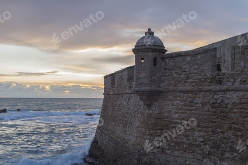 Preview: Scenic view of the famous Castle San Sebastian Cadiz on the coast of Andalucia, Spain at sunset