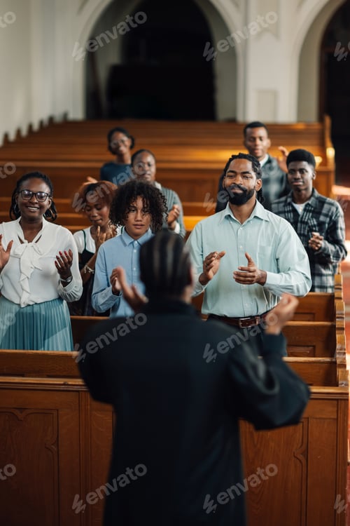 Preview: Congregation clapping along to gospel music during church service