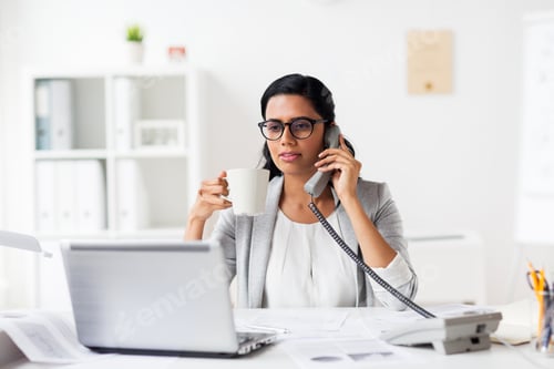 businesswoman calling on phone at office