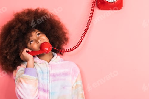 Preview: Black girl speaking on telephone in studio