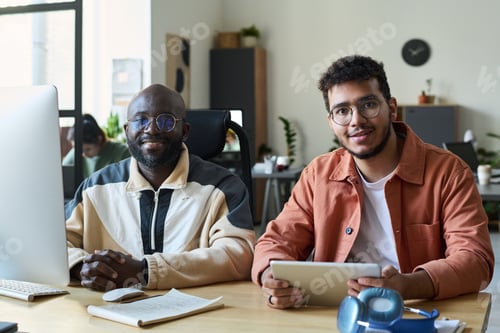 Preview: Guys using desktop computer and tablet