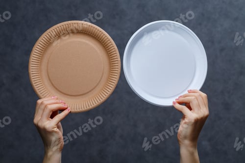 Preview: Zero waste concept. Wooden cutlery versus plastic cutlery. Eco-friendly disposable tableware made