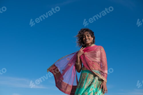 Preview: Happy woman in traditional clothing shot outdoors