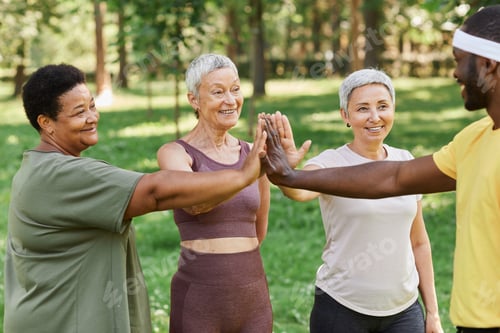 Preview: Active senior women high five with trainer after enjoying outdoor workout