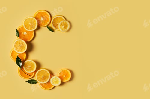 Preview: Serum bottle and orange slice on yellow background