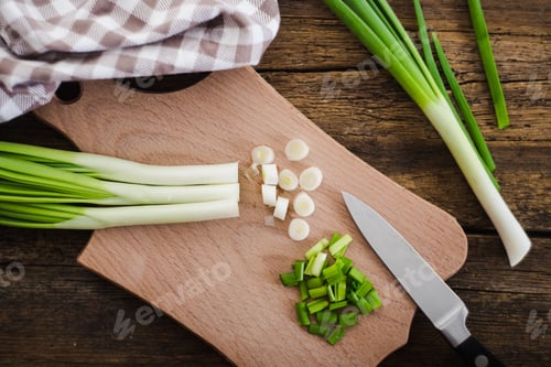 Preview: Green onions on wooden background. Cooking