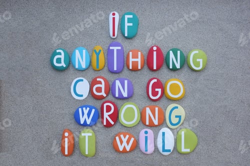 Preview: If anything can go wrong, it will, creative quote composed with multi colored stone letters over gre