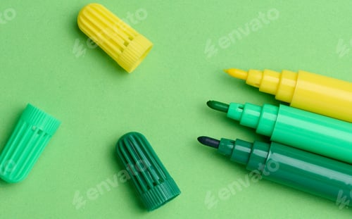 Preview: Green and yellow markers on a green background, top view