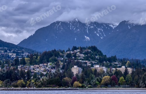 Preview: Residential Homes in a modern city with mountain landscape in background.