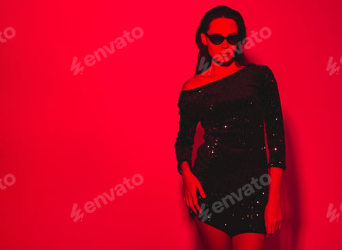 Preview: Young fashion woman posing in studio