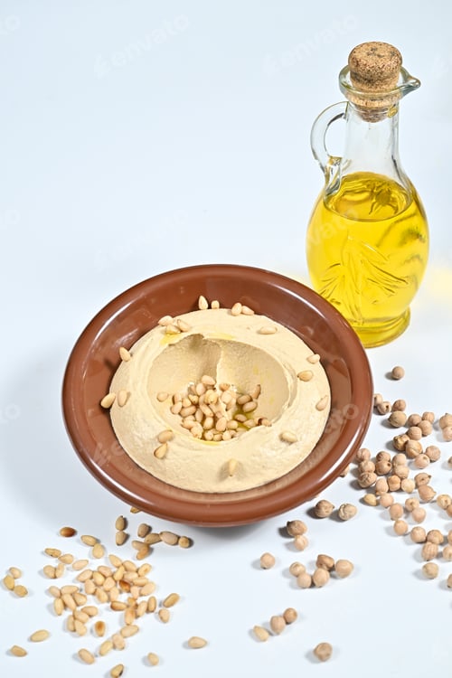 Preview: Bowl of hummus topped with peanut chips