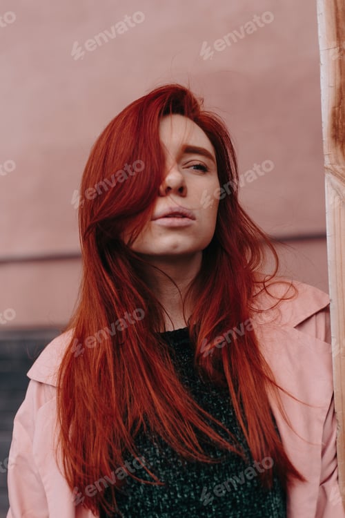 Preview: Beautiful And Stylish Girl With Red Hair Walks In The City And Her Hair Is In The Wind