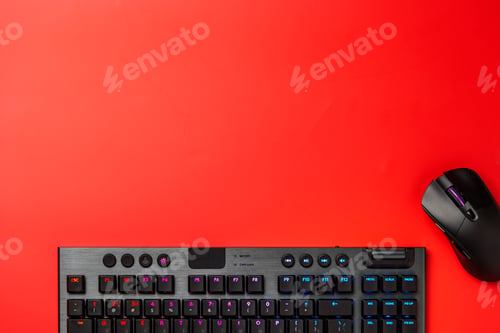 Preview: Computer keyboard and mouse on red background top view