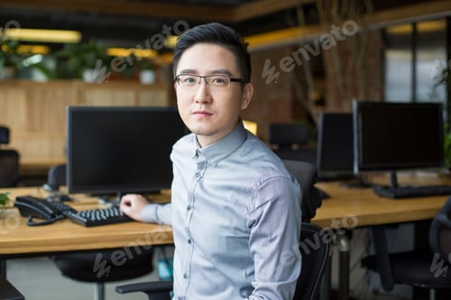 Preview: IT worker sitting in office