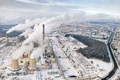 Preview: Thermal power plant in winter in the city of Minsk. Smoke is coming from the big Chimneys