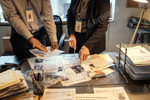 Preview: Hands of intercultural agents of FBI discussing criminal profiles by workplace