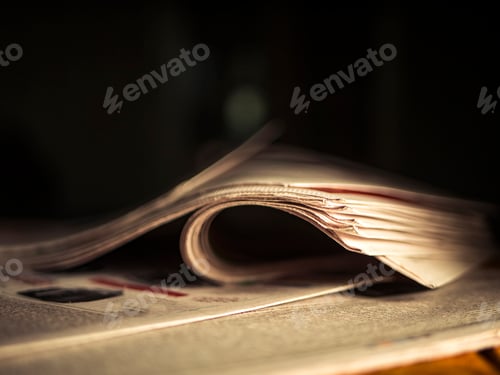Preview: close up wrinkled newspaper on the table in the dark room