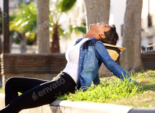 Preview: Black woman laughing outside
