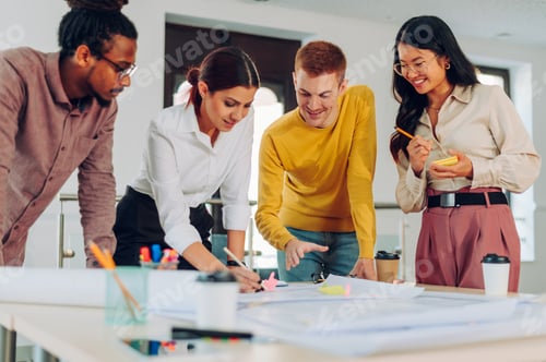Preview: Diverse group of engineers or architects having a meeting in an office
