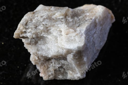 Preview: sample of unworked oligoclase rock on black