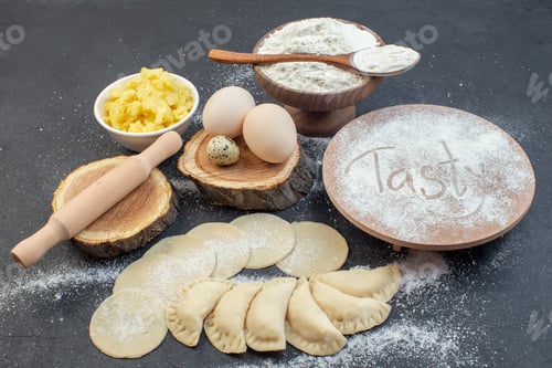 Preview: front view raw potato hotcakes with eggs mushed potatoes and flour on dark background meal pie