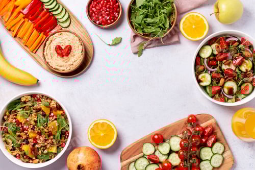 Preview: Vegan or veganuary feast with various salads ad healthy plates on light gray table