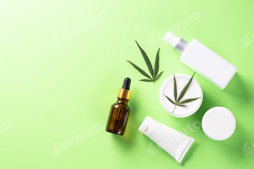 Preview: Cannabis cosmetic products on green background top view