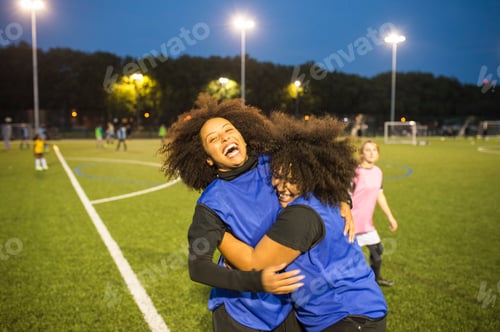 Preview: Female football players jubilant, Hackney, East London, UK
