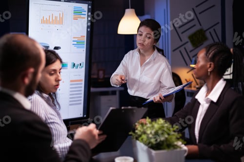 Preview: Diverse multi ethnic teamwork brainstorming company ideas analyzing financial graphs presentation