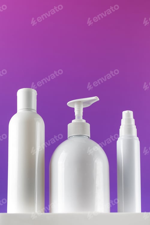 Preview: Mockups of white containers with cosmetics on a pedestal. Cosmetics store concept.