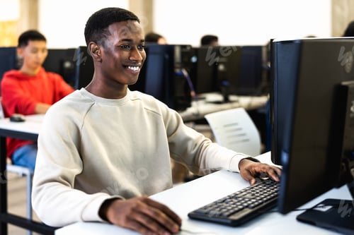 Preview: Young African student having an exam in high school - Education and technology concept
