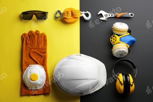 Preview: Flat lay composition with safety equipment and space for text on color background