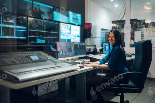 Preview: Middle aged woman using equipment in control room on a tv station