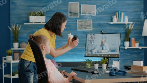 Preview: Mother using video call with doctor for healthcare treatment