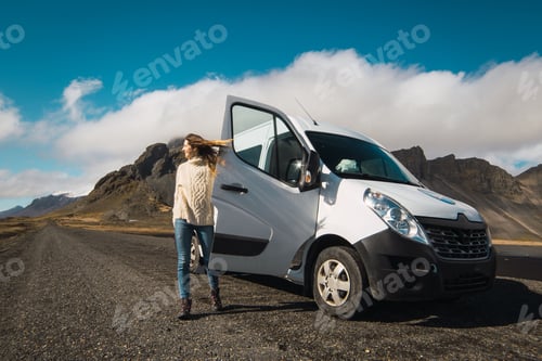 Preview: Woman near traveling bus in mountains