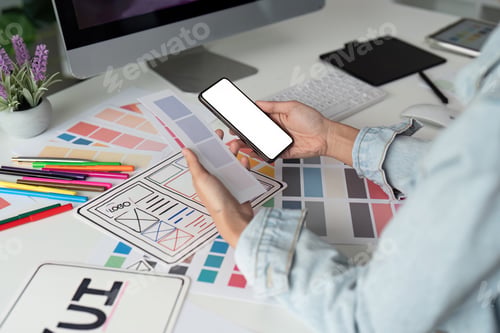 Preview: UI designer and UX developer brainstorm idea to design the application interface. Creative digital