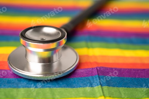 Preview: Black stethoscope on rainbow background, symbol of LGBT pride month celebrate annual