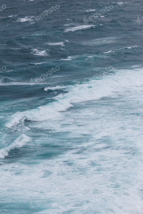 Preview: aerial view of ocean with foamy waves for background