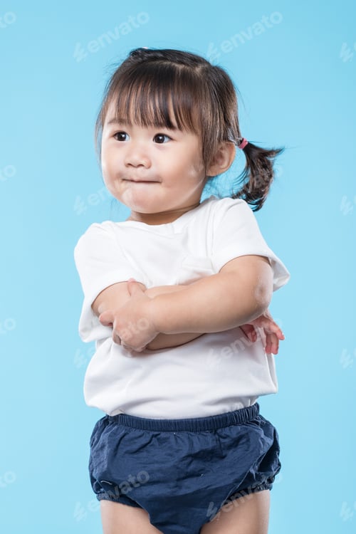Preview: Little girl arm cross over blue background