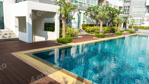 Preview: palm trees Garden near swimming pool , clean water swimming pool in the condominium roof top