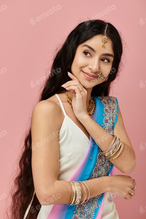 Preview: Serene Beauty in Blue: Woman Poses on Pink