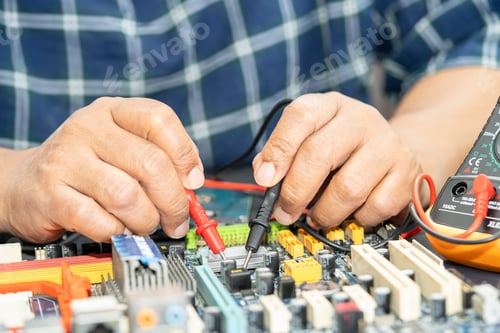 Preview: Technician repairing inside of mobile phone by soldering iron.