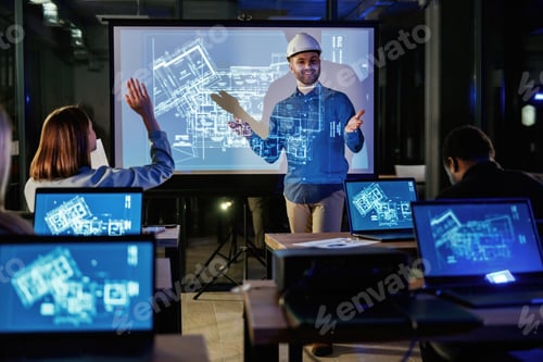 Preview: Explaining stuff. Male architect is showing construction site project on blue projector for people