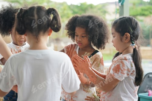 Preview: Group of happy children playing at playground