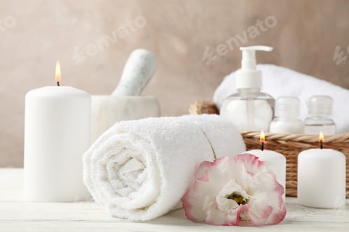 Preview: Spa accessories and flower on white wooden background, close up